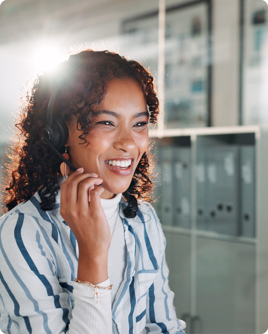 Smiling woman with headset in office
