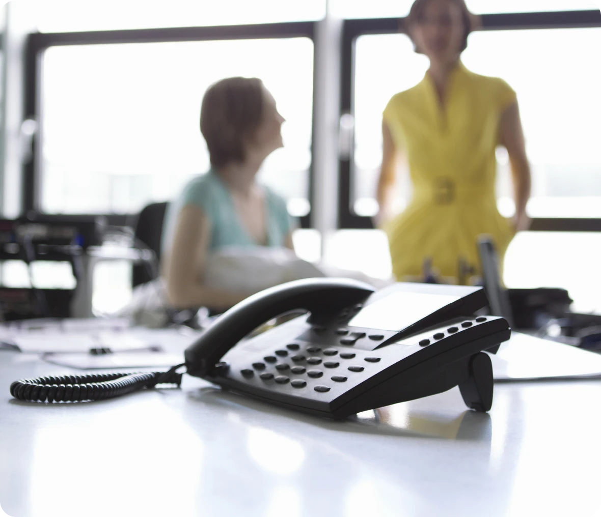 Telephone focus, blurred office setting