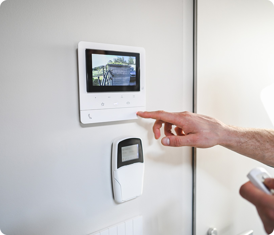 Person using a home security monitor