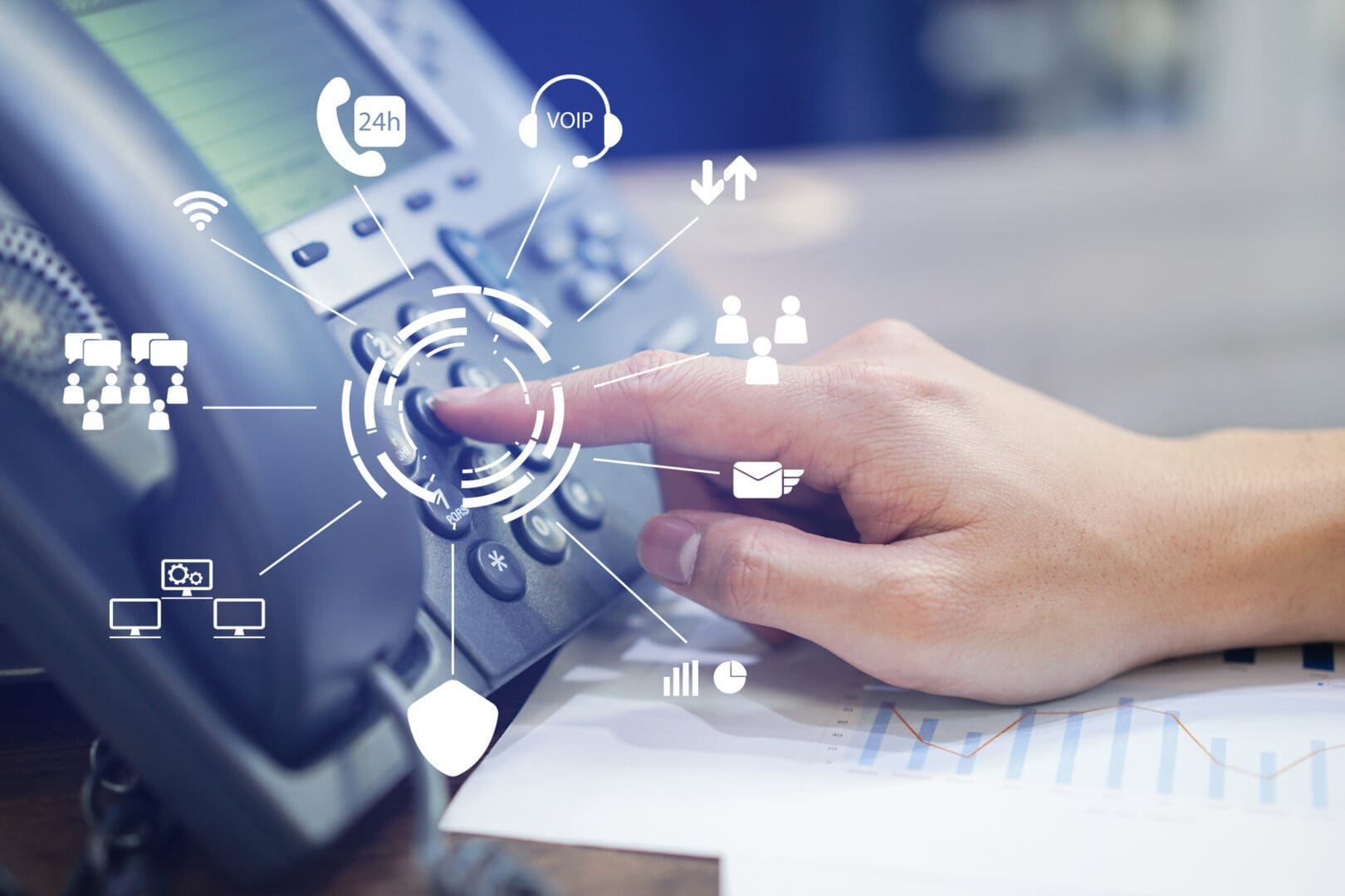 Finger pressing desk phone with communication icons